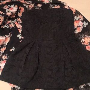 Black, strapless bodice-flare at empire waist.